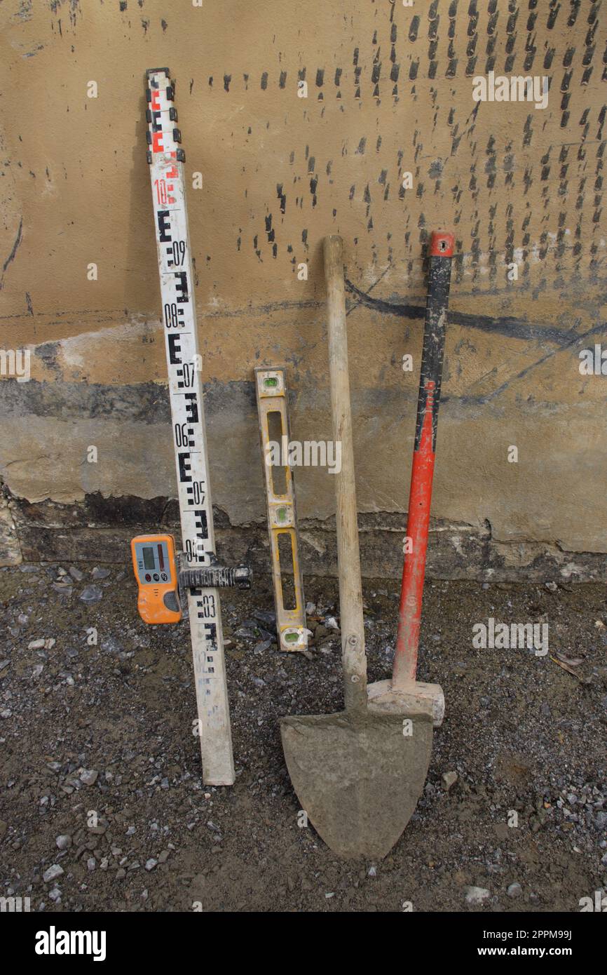 Tools on a construction site are on the wall Stock Photo