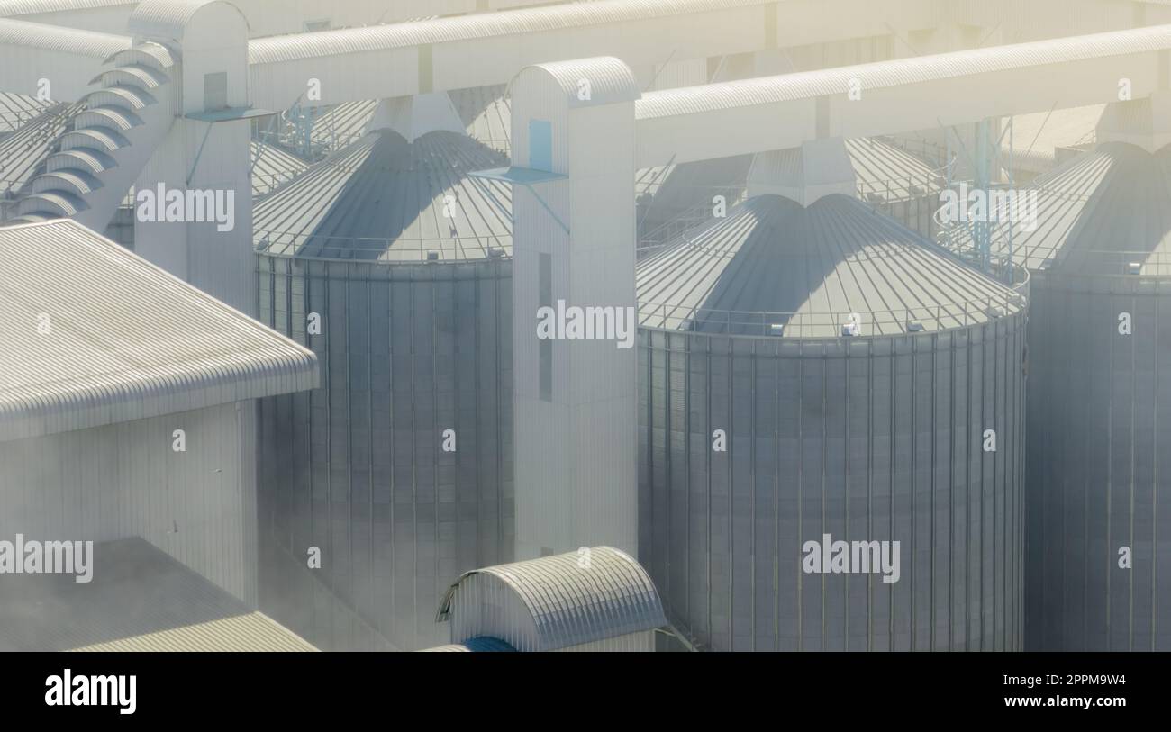 Animal feed factory. Agricultural silo at feed mill factory. Tank for