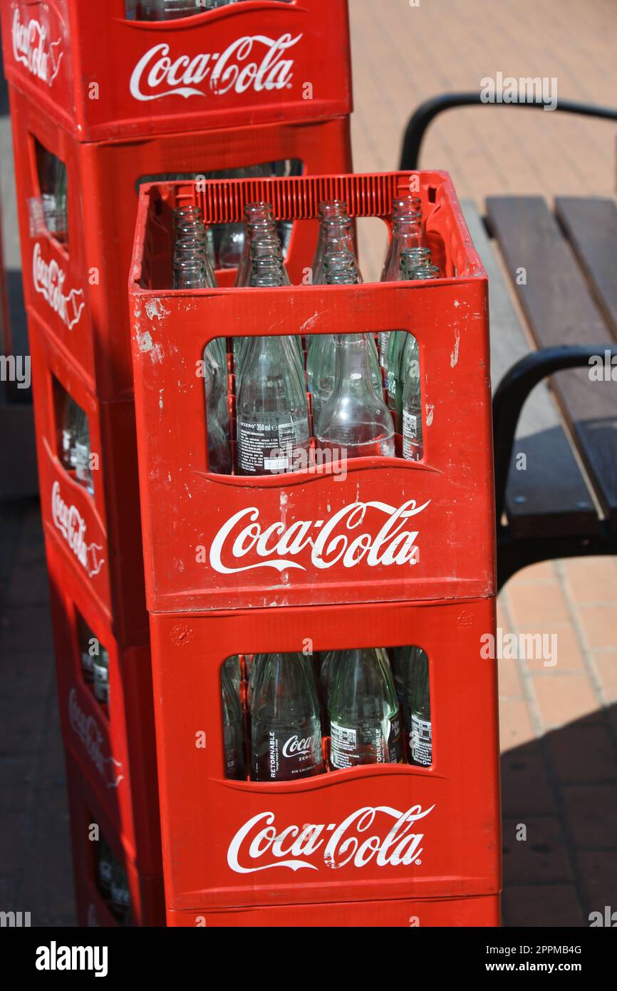 â€žCoca Colaâ€œ crates lie on the street in La Nucia, Alicante Province