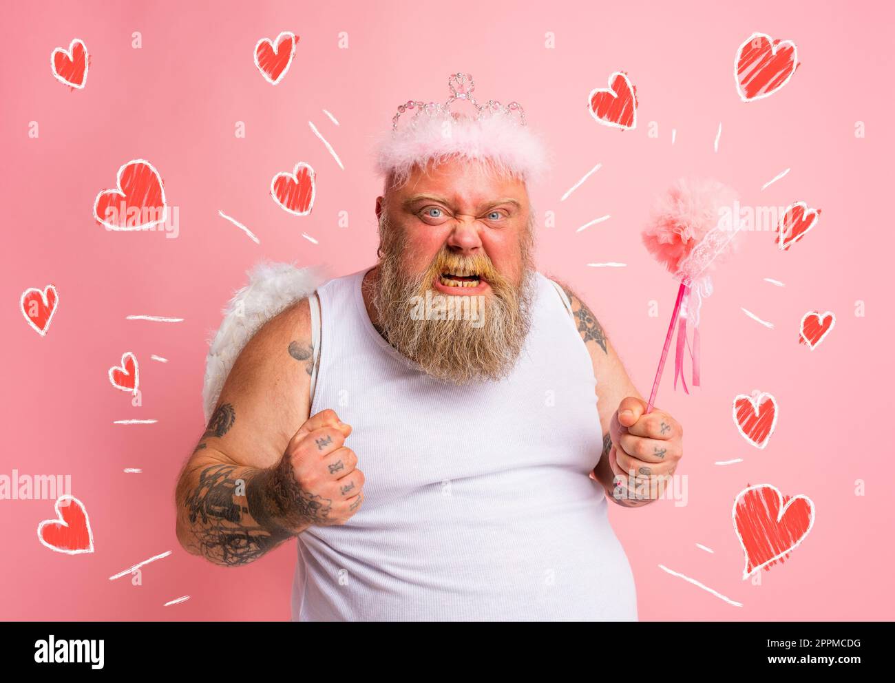 Fat angry man with tattoos acts like a magical fairy Stock Photo