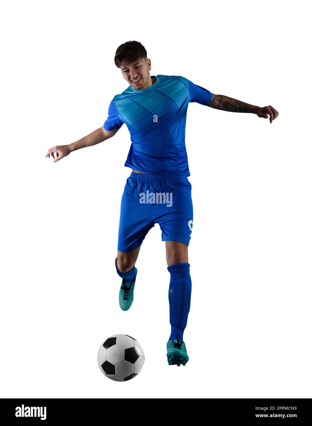 Football player ready to kick the soccerball during the match Stock Photo
