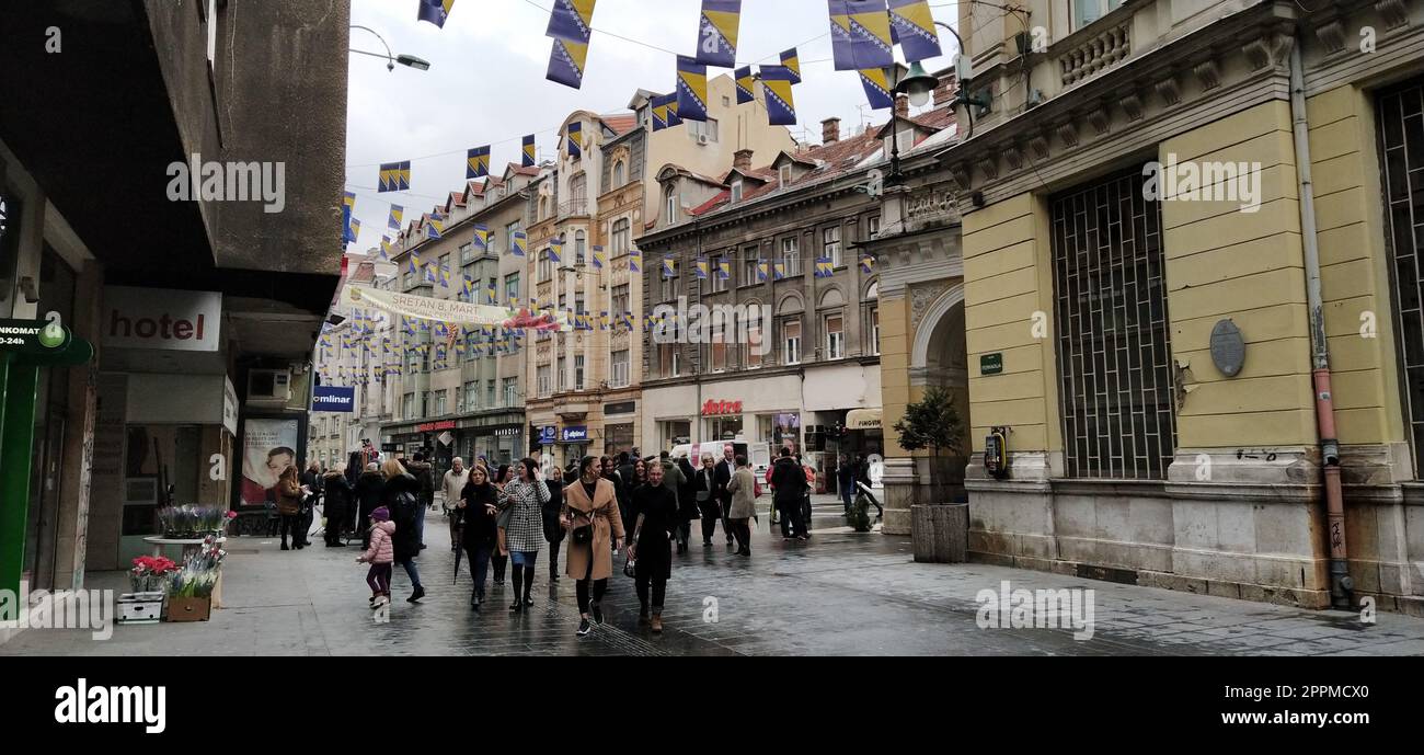 Sarajevo, Bosnia and Herzegovina, March 8, 2020. People on the streets of Sarajevo. Tourists and locals walk around the city center, visit shops, cafes. Historic Center of Sarajevo with Attractions Stock Photo
