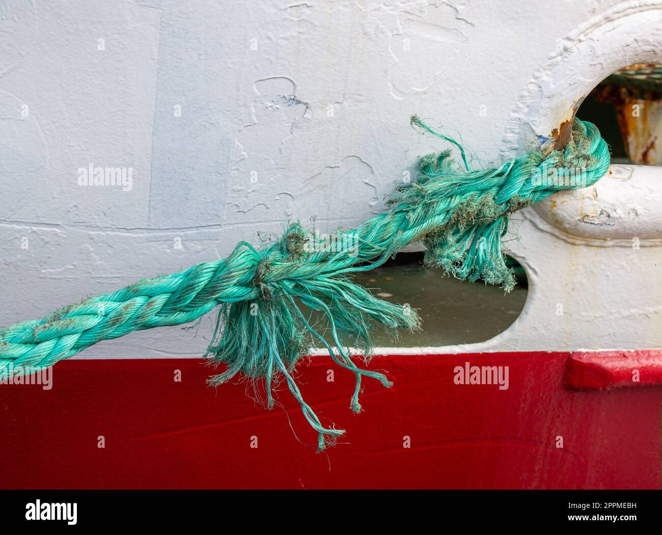 Badly frayed mooring line about to snap or part. Stock Photo