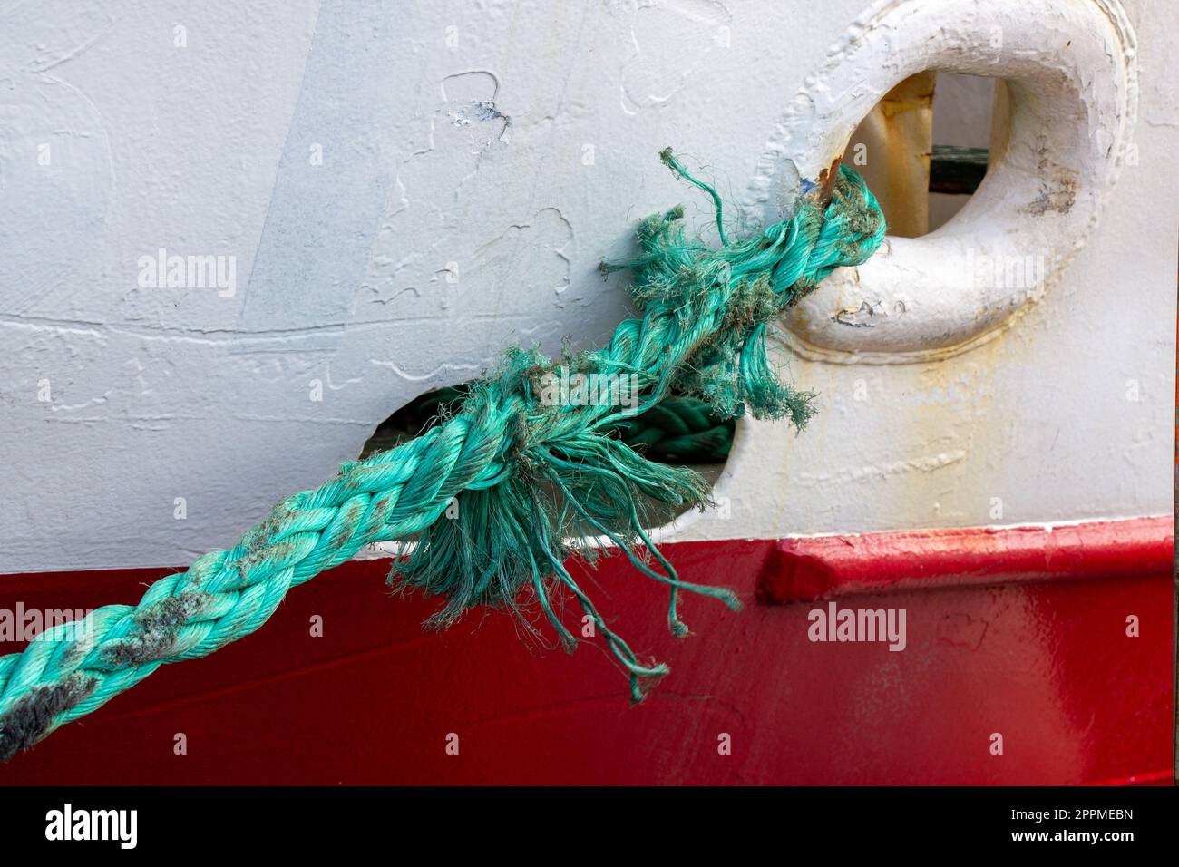 Badly frayed mooring line about to snap or part. Stock Photo