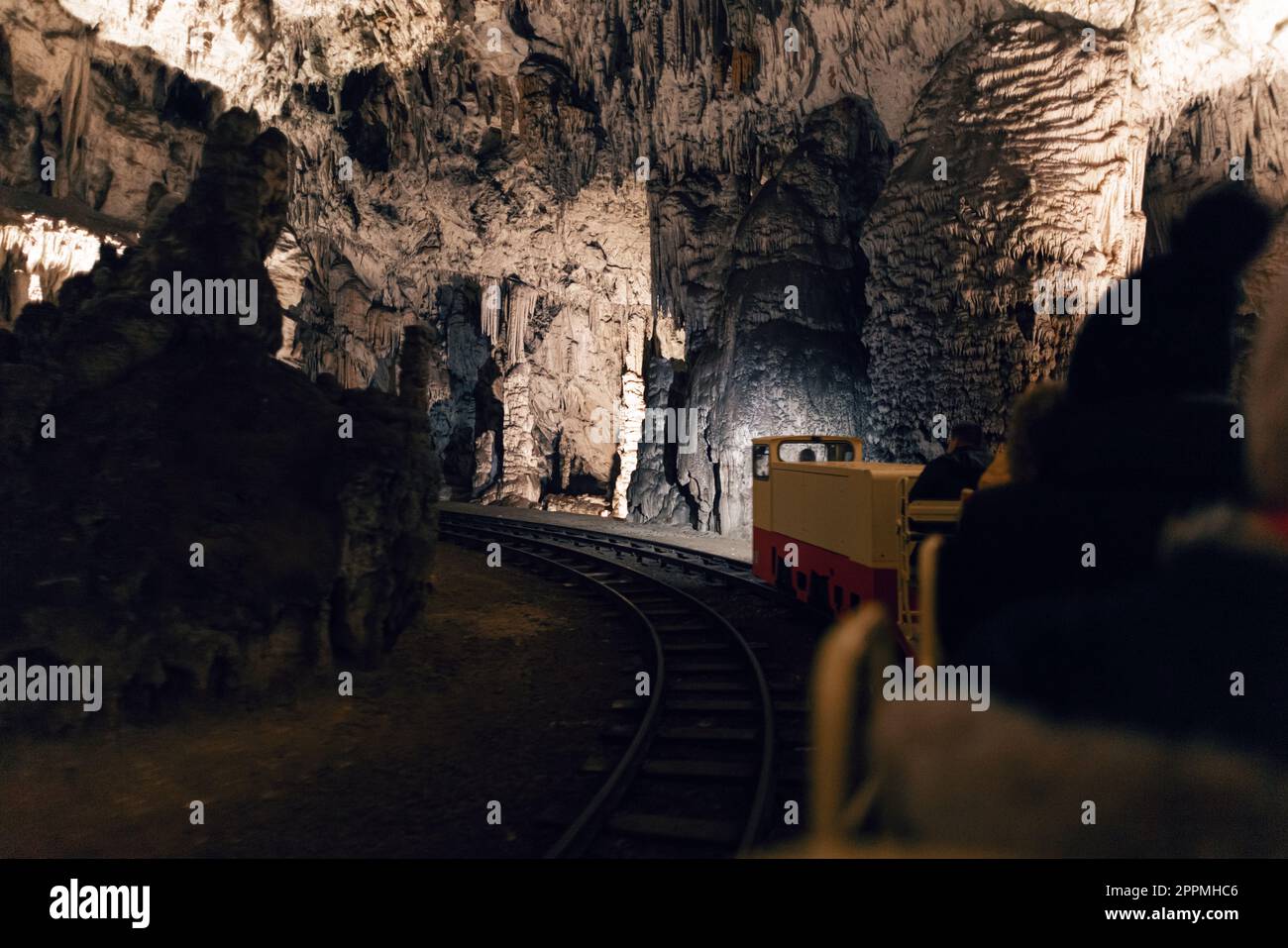 Karst cave with a railway Stock Photo