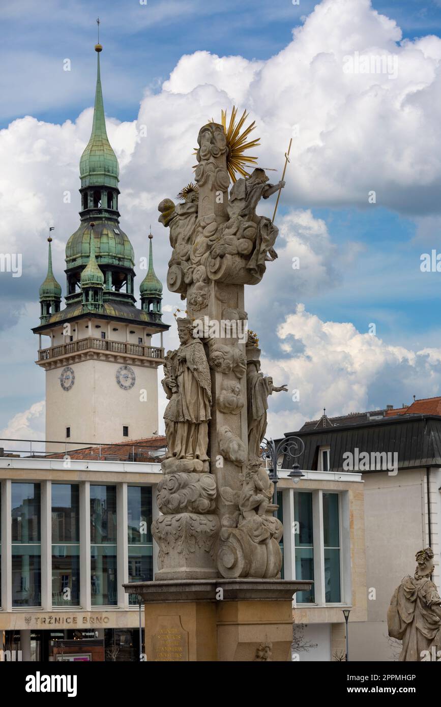 17th century Holy Trinity column on Cabbage Market and tower of Old Town Hall in the distance, Brno, Czech Republic Stock Photo