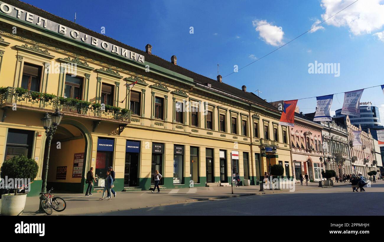 Novi Sad, Serbia 30 April 2022 Hotel Vojvodina is the oldest hotel in the center of the city. European tourism facility. Street with passers-by. Freedom Square. Hotel with rooms provision of services Stock Photo