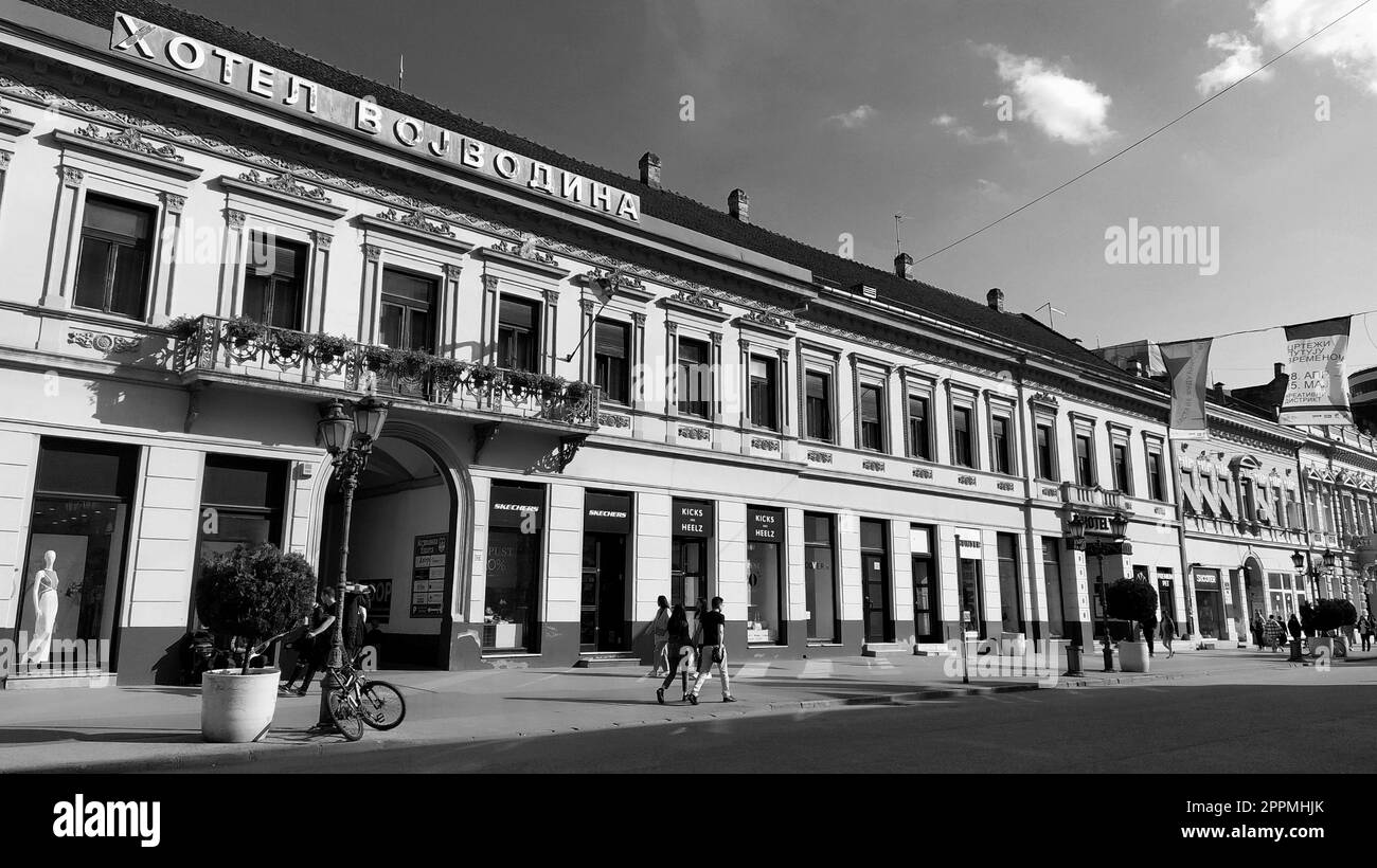 Novi Sad, Serbia 30 April 2022 Hotel Vojvodina is the oldest hotel in the center of the city. European tourism facility. Street with passers-by. Freedom Square. Hotel with rooms provision of services Stock Photo