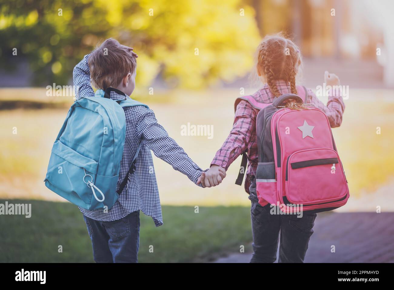 Boy and girl holding hands hi-res stock photography and images - Alamy