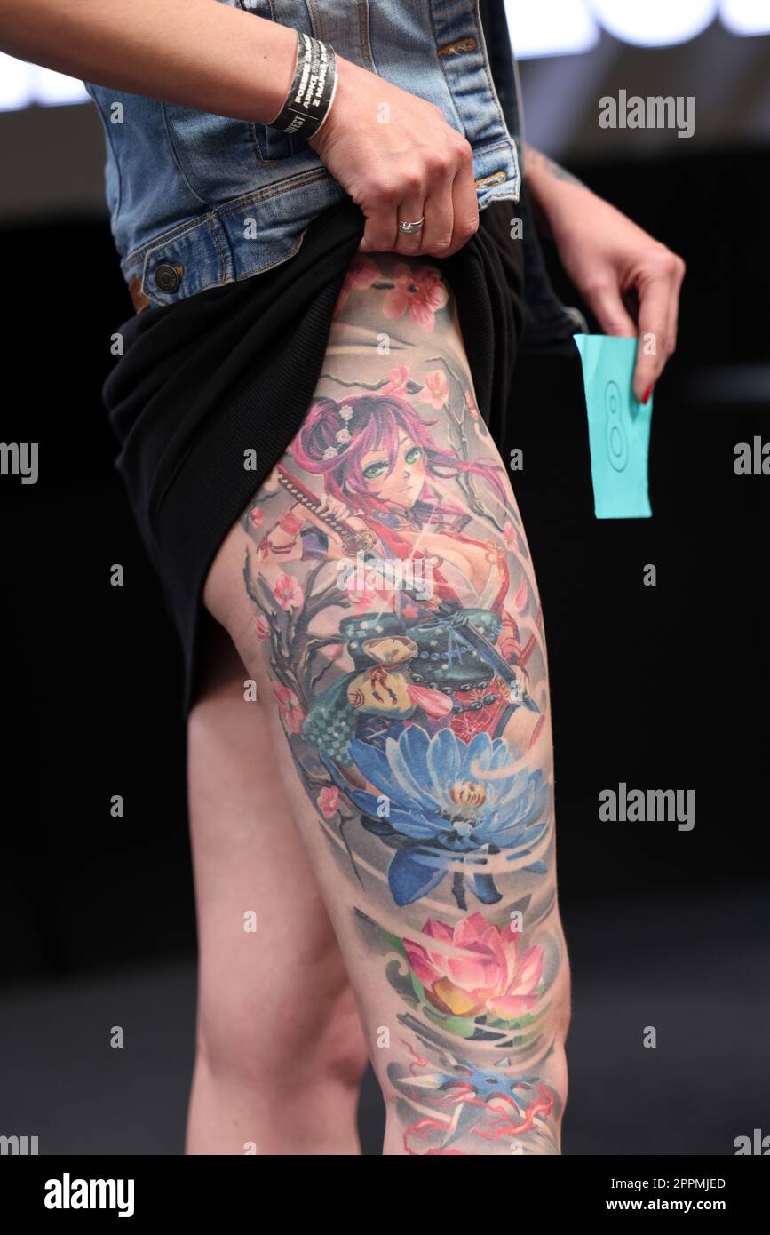 Unidentified participant during the contest for the best tattoo at the 15th Tattoofest Convention in Cracow. One of the most prestigious tattoo festivals. Stock Photo