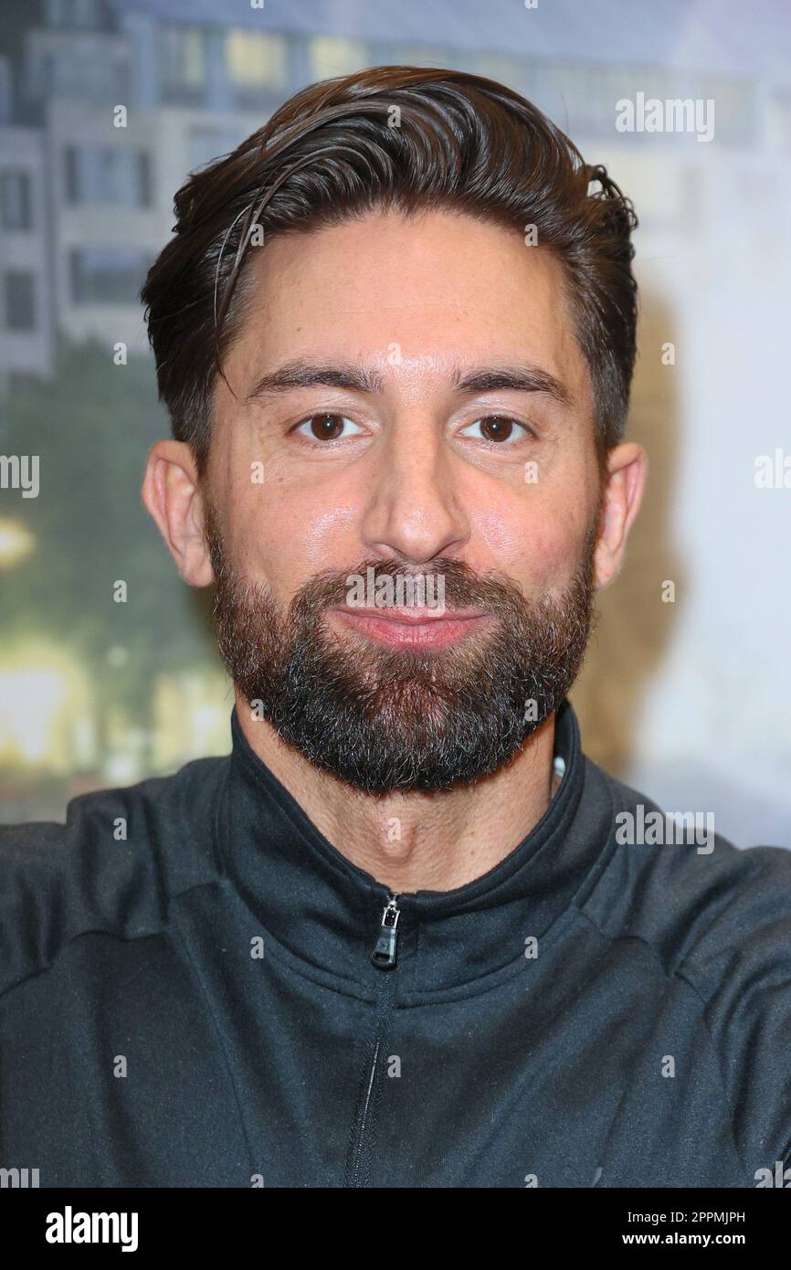 Sebastian Fobe,charity cycling in the Europa Passage where a light bulb is lit up with ergometers. The money goes 1:1 to Ukrainian aid projects in cooperation with the organization #WeAreAllUkrainians,Hamburg,09.03.2023 Stock Photo