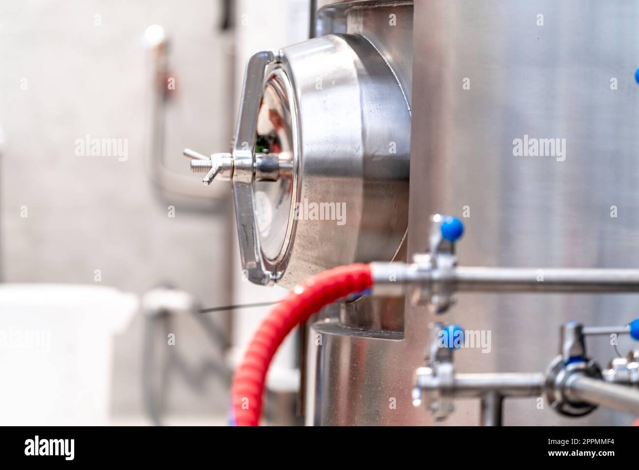 stainless steel boilers and vessels with pipes for brewing beer in a