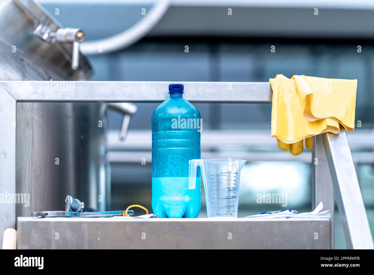 chemicals and gloves for cleaning stainless steel surfaces Stock Photo