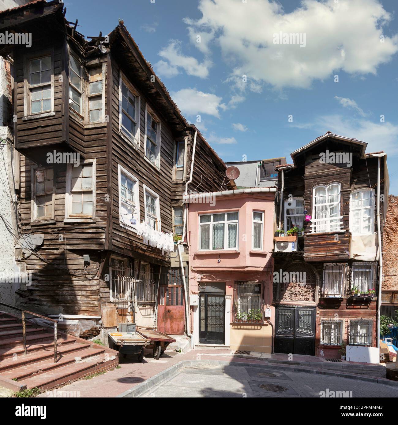 Old traditional wooden and stone houses, and stone staircase, in old Balat district, on a summer day, Istanbul, Turkey Stock Photo