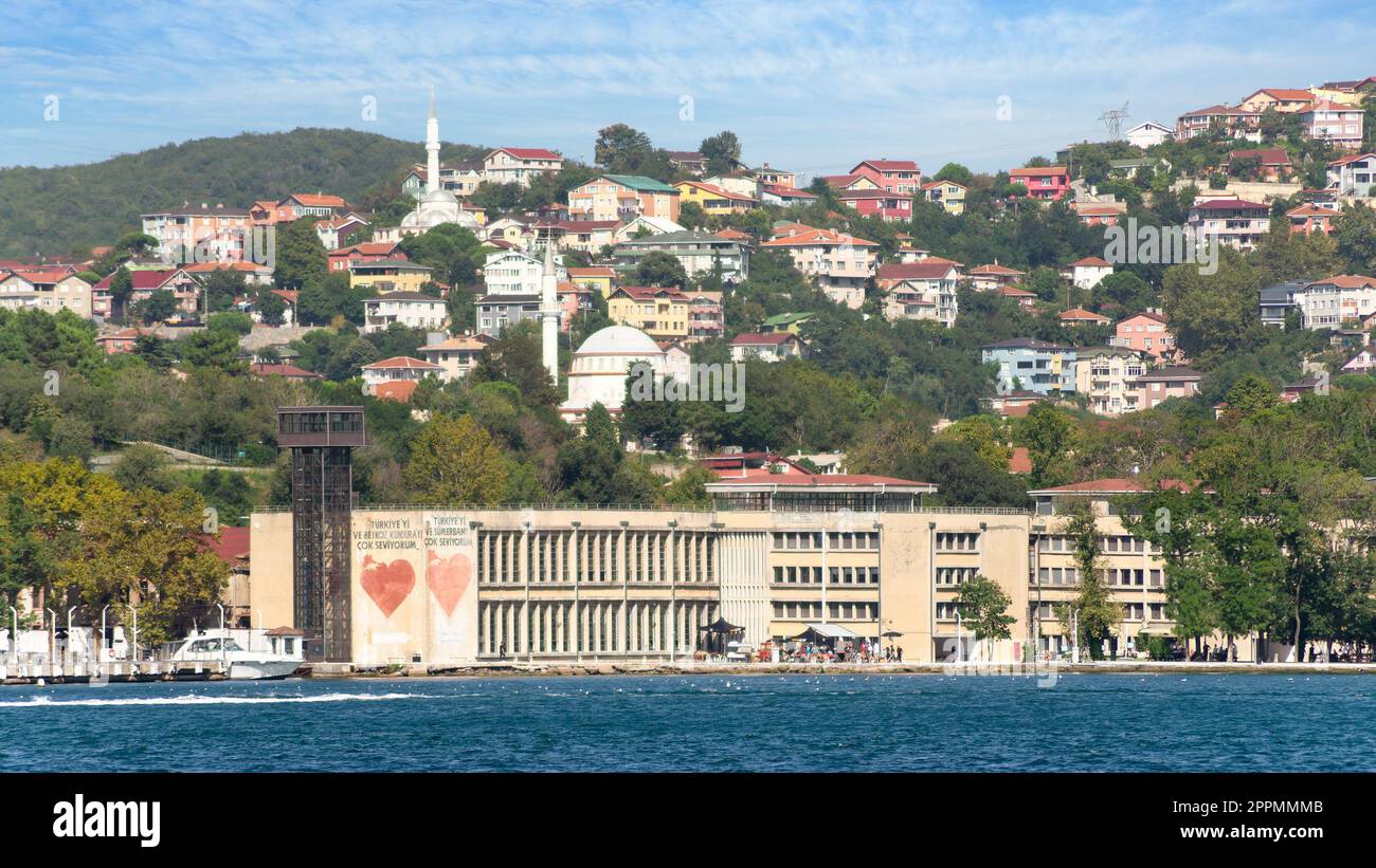 Green mountains of the Asian side of Bosphorus strait, with traditional buildings and dense trees in a summer day Stock Photo