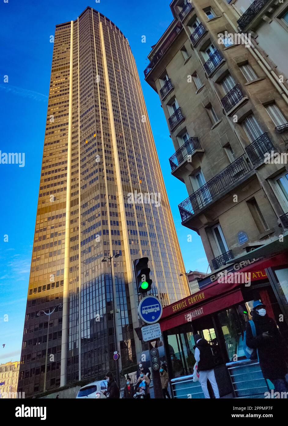 210 meter office skyscraper Maine-Montparnasse Tower (Tour Maine-Montparnasse, 1973) at Avenue du Maine in Paris. Sunset. Stock Photo