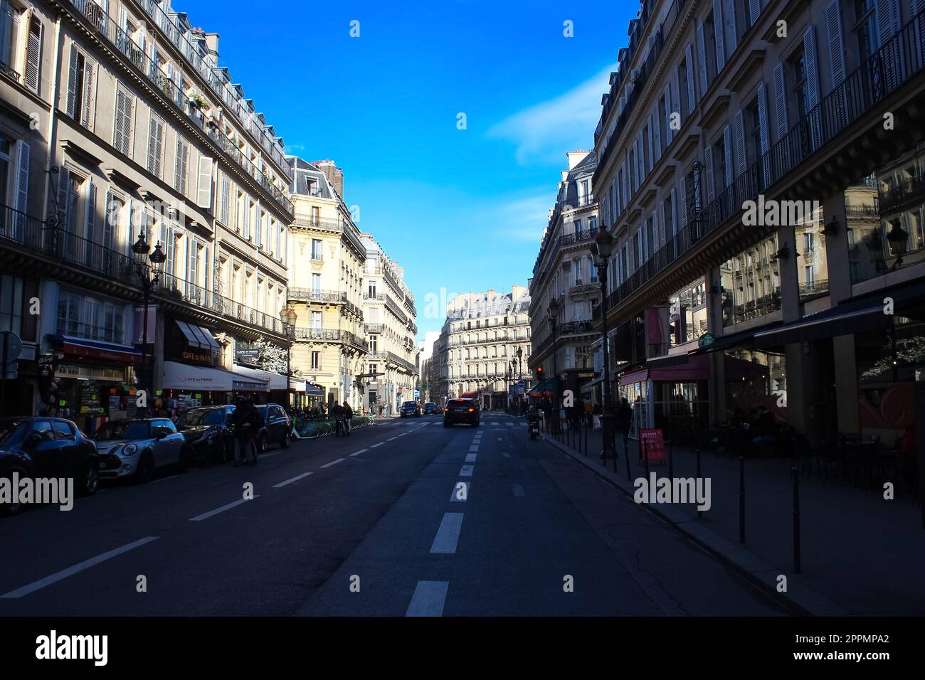 St-Honore Street. Citizens are sitting in the cafe. On the sidewalks are pedestrians Stock Photo