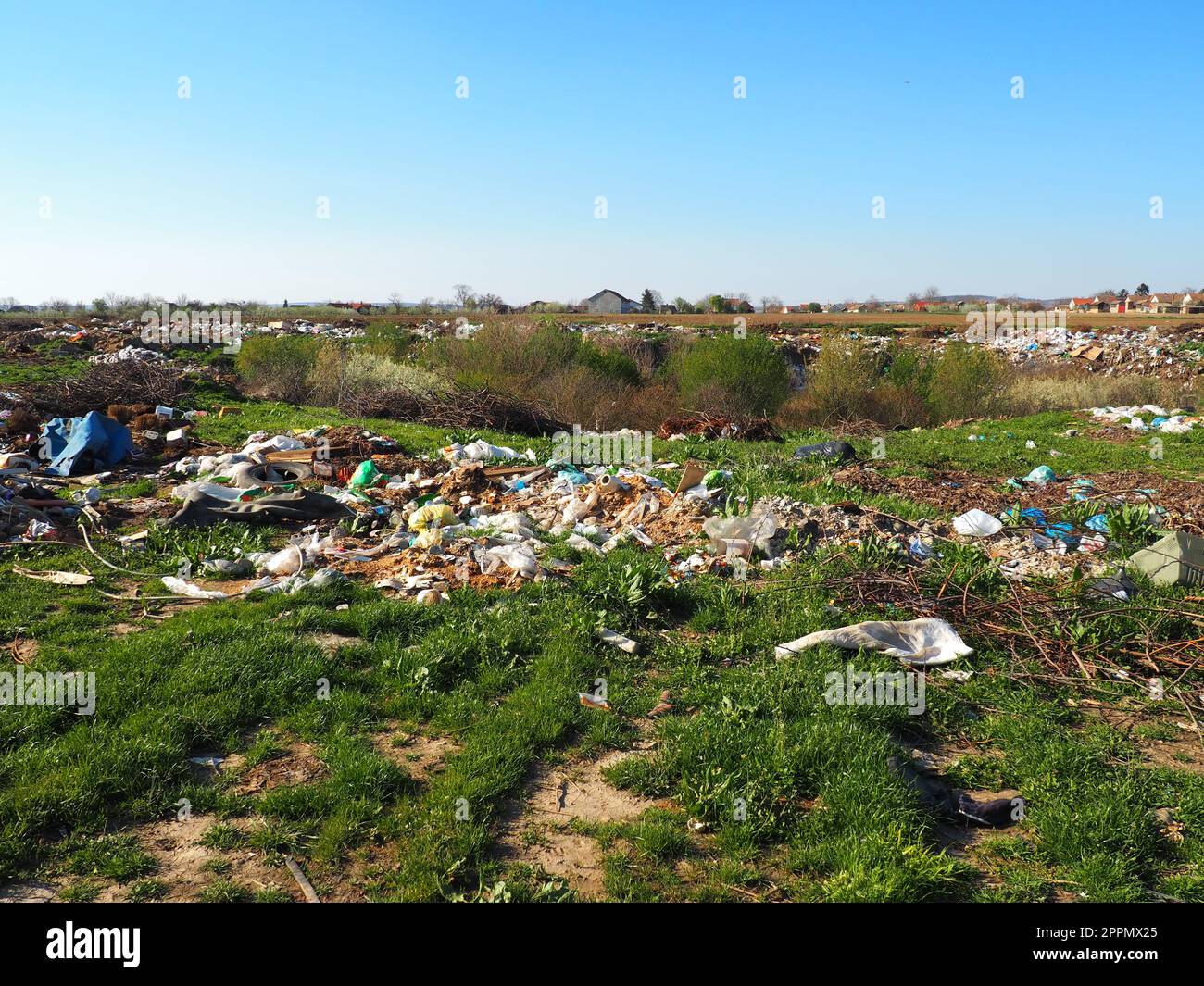 garbage dump near the village. Chaotic unofficial dump. Plastic, bags