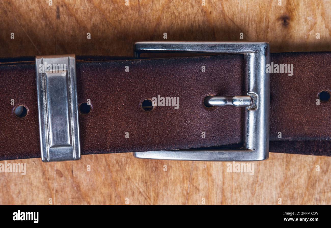 Male leather belt on the table Stock Photo