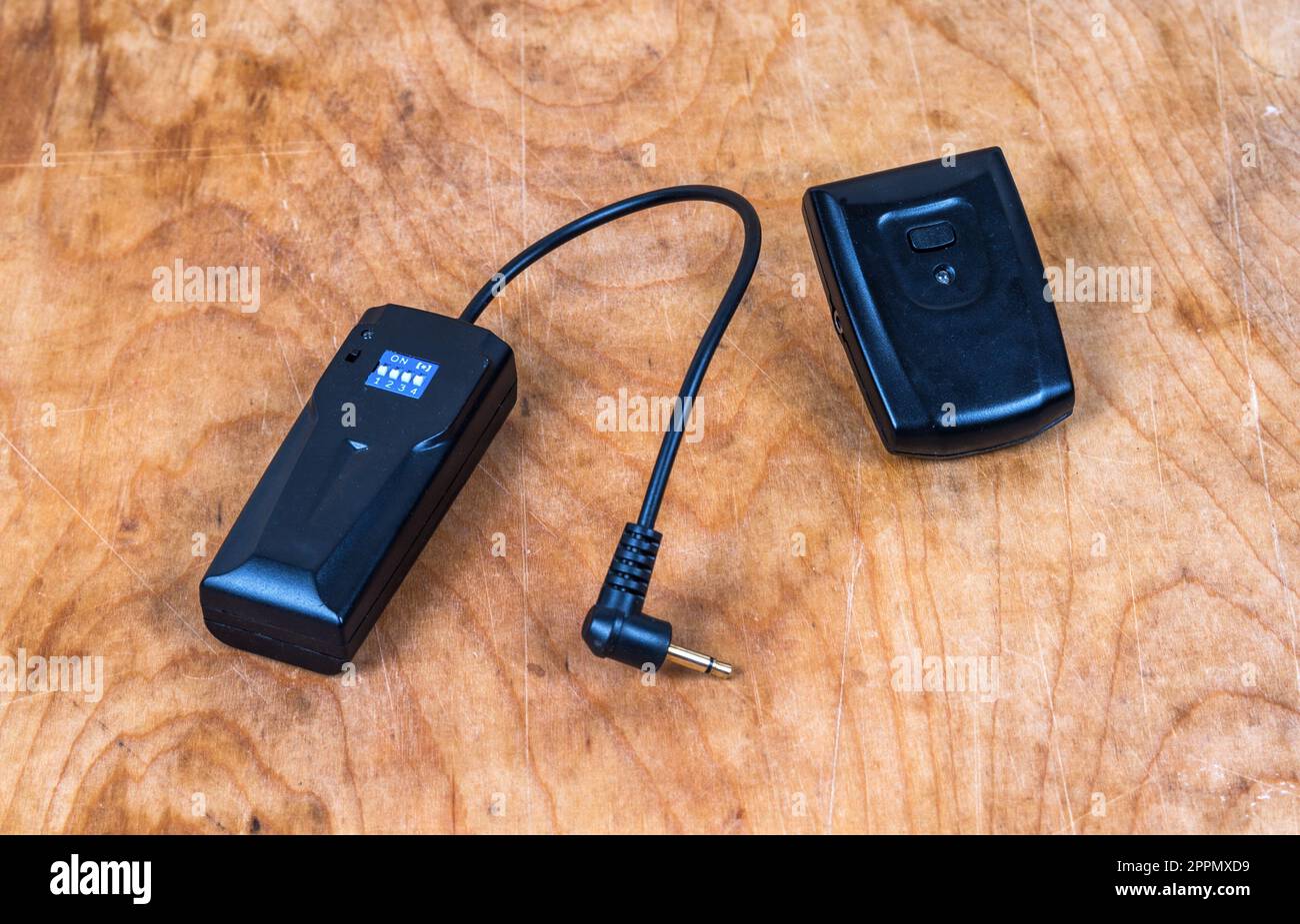 Studio flash transmitter and receiver on table Stock Photo