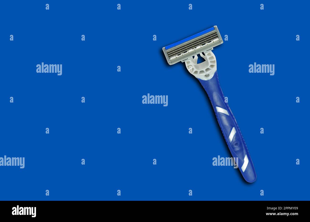 Blue shave razor on the blue Stock Photo