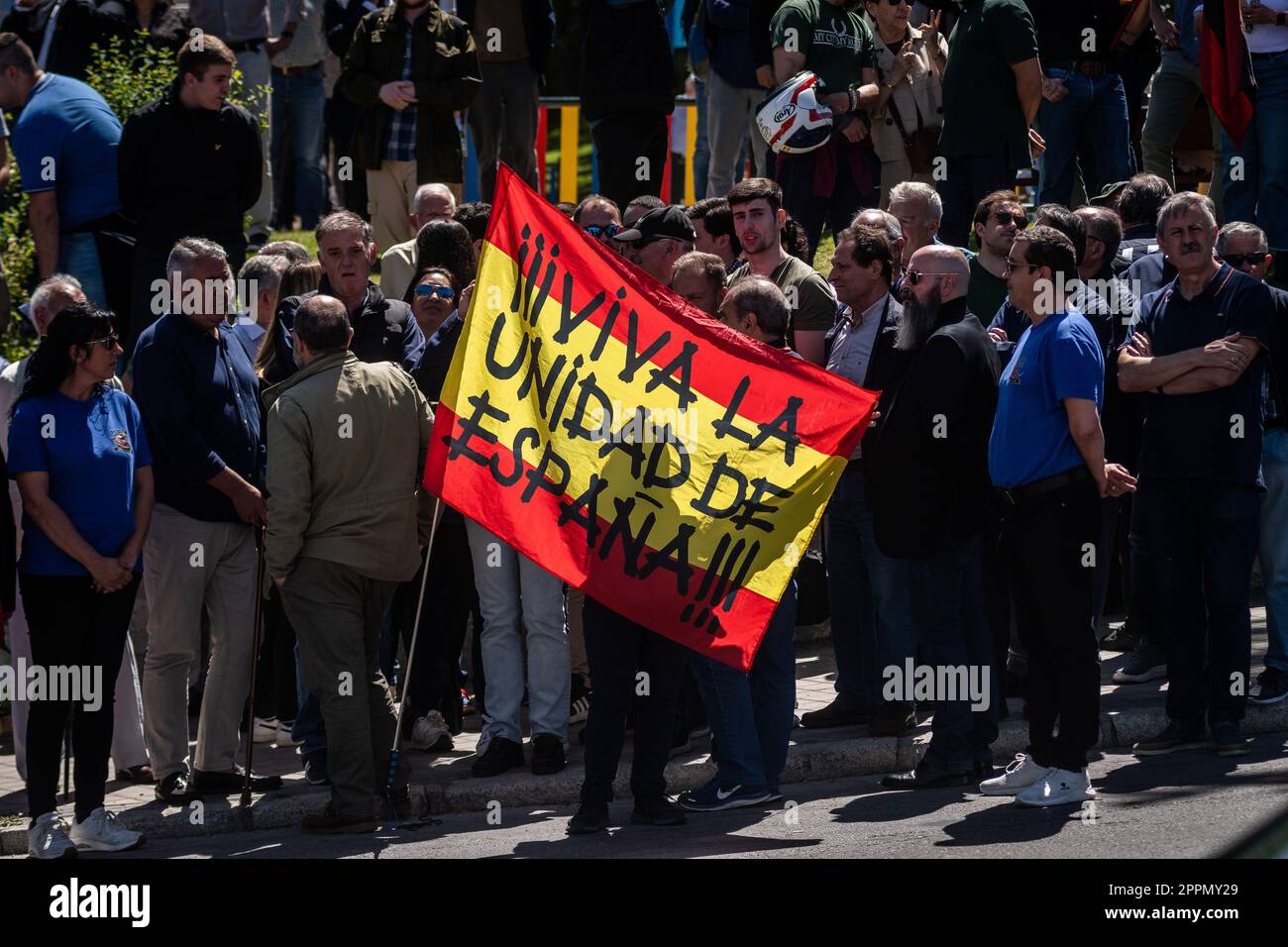 Madrid, Spain. 24th Apr, 2023. A flag of Spain with the words 'Long live the unity of Spain' is seen during a protest in front of the San Isidro cemetery. Members and supporters of La Falange party have gathered to protest the day of the exhumation of the remains of the founder of Falange, Jose Antonio Primo de Rivera, the fascist politician's remains were exhumed from the Valle de los Caidos (known now as Valle de Cuelgamuros) and transferred to the San Isidro cemetery. Credit: Marcos del Mazo/Alamy Live News Stock Photo