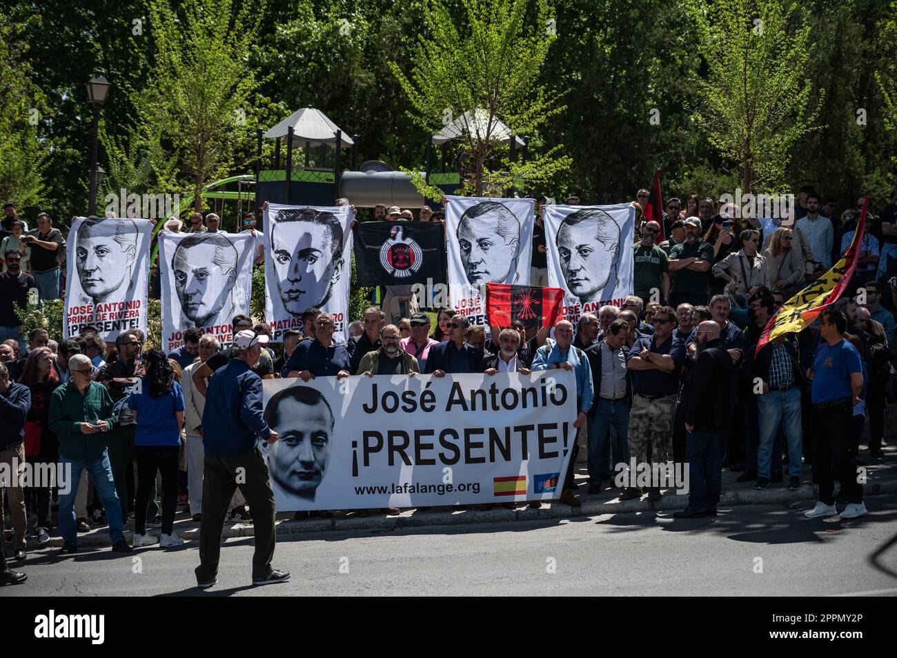 Madrid, Spain. 24th Apr, 2023. Members and supporters of La Falange party carrying banners during a protest outside the San Isidro Cemetery the day of the exhumation of the remains of the founder of Falange, Jose Antonio Primo de Rivera. The fascist politician's remains were exhumed from the Valle de los Caidos (known now as Valle de Cuelgamuros) and transferred to the San Isidro cemetery. Credit: Marcos del Mazo/Alamy Live News Stock Photo