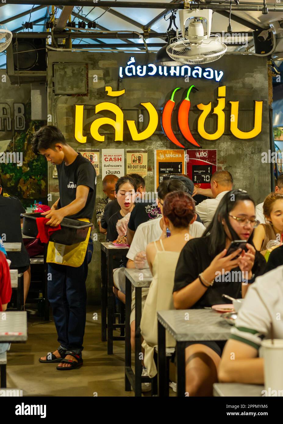 Eating dinner at Jodd Fairs Night Market at Rama iX, Bangkok, Thailand Stock Photo