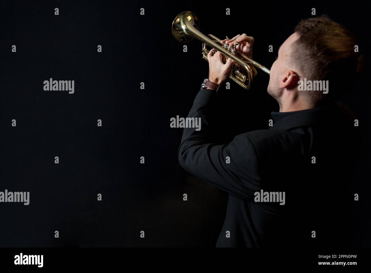 Trumpet player black background Stock Photo Alamy