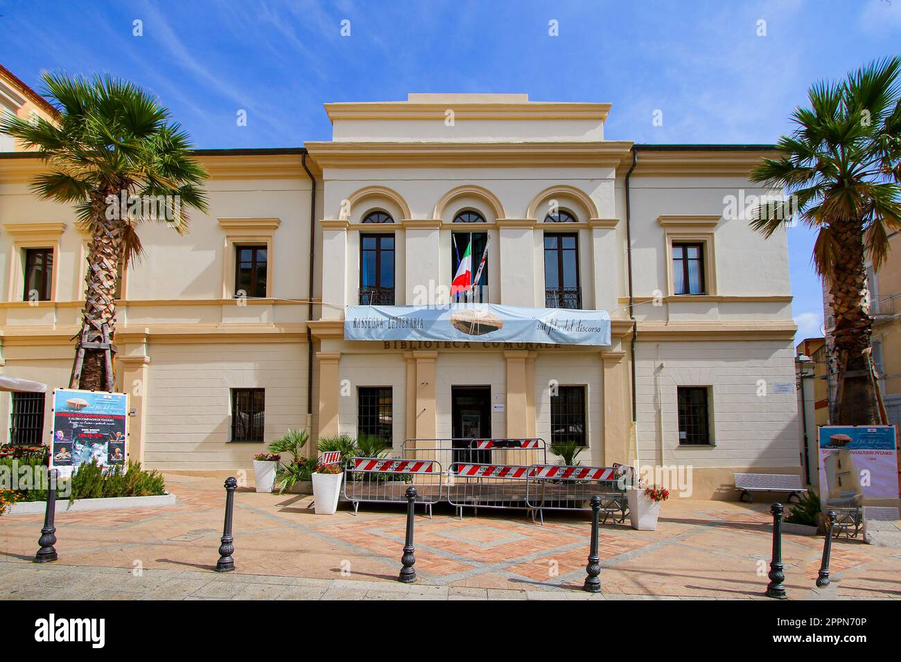 Olbia, Sardinia - August 8, 2019 : Facade of the Municipal Library of Olbia in Sardinia, Italy - Old building in the historical city center of this to Stock Photo