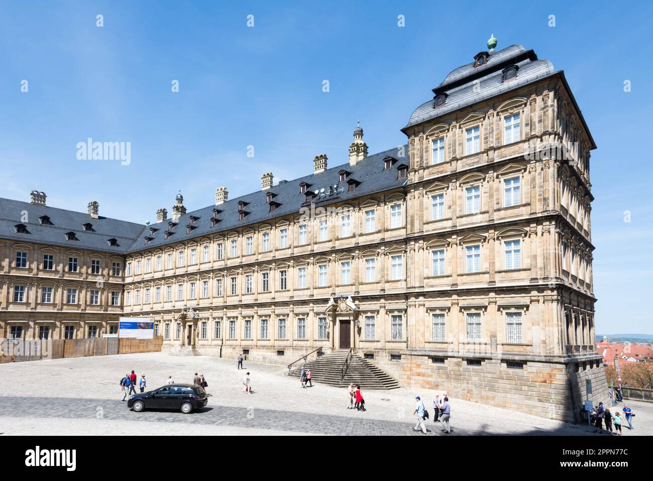 BAMBERG, GERMANY - MAY 6: Tourists at Neue Residenz in Bamberg, Germany on May 6, 2016. The Neue Residenz was the former residence of the bishops of Stock Photo