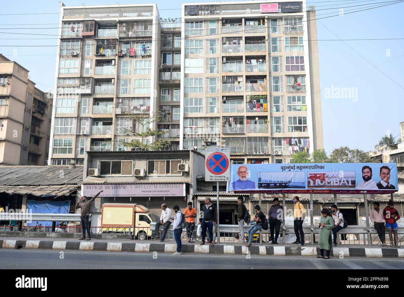 INDIA, Mumbai, residential area along western highway, apartment blocks, large billboard with the Indian Prime Minister, Narendra Modi Stock Photo