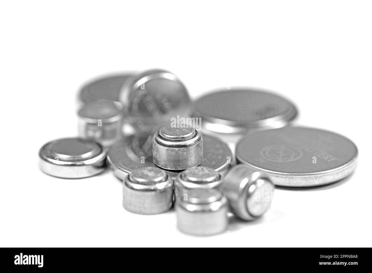 Various button cells against white background Stock Photo Alamy