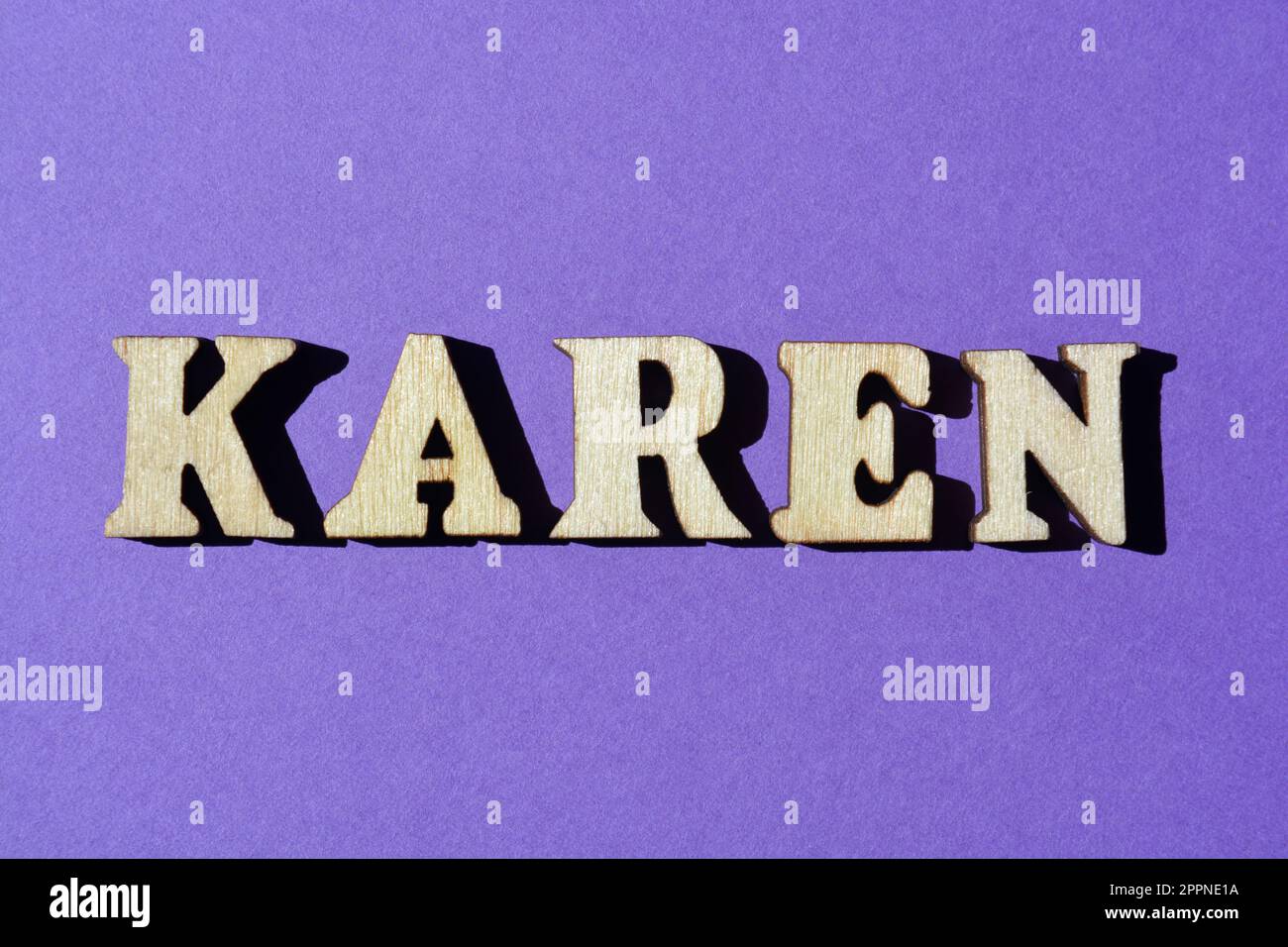 Karen, word in wooden alphabet letters isolated on purple background Stock Photo