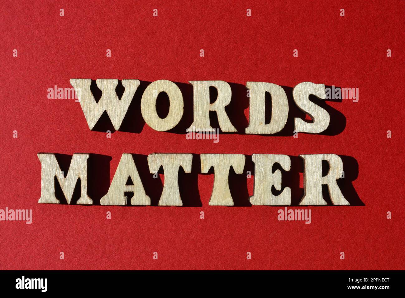 Words Matter, in wooden alphabet letters isolated on red background Stock Photo