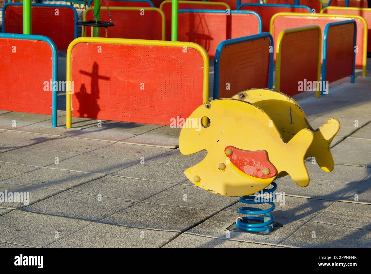 Playground Rocking Thing Childrens playground outdoors with a rocking play tool in bright colors ...