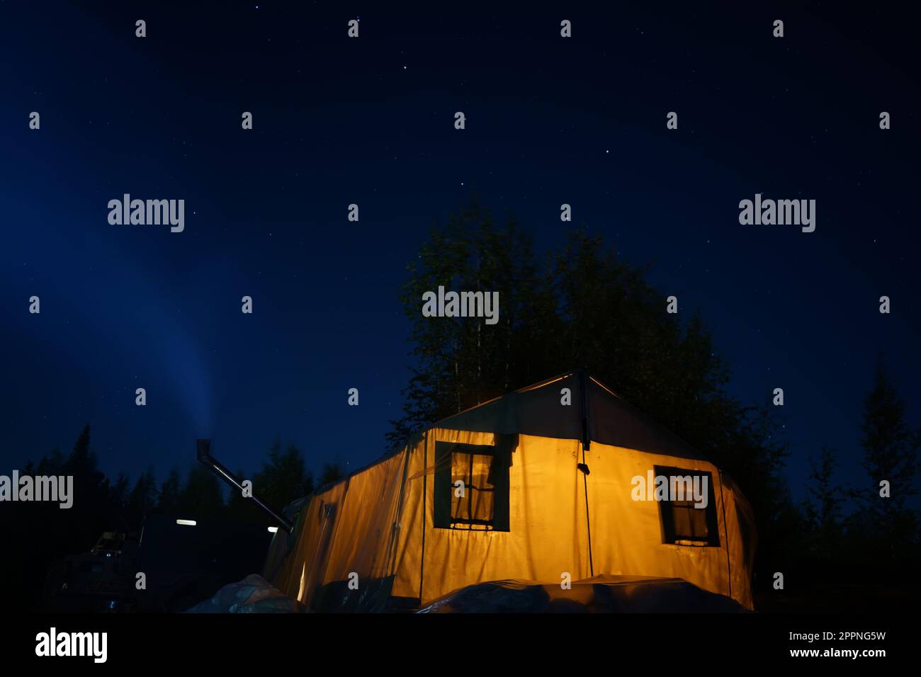 large expedition tent with protruding chimney from the furnace under