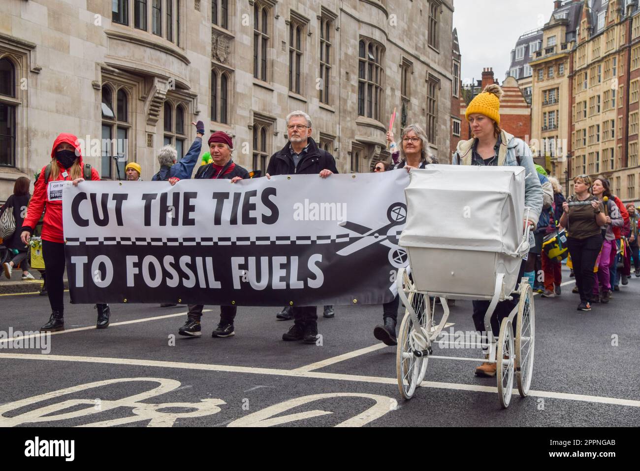 London, England, UK. 24th Apr, 2023. An activist pushes a pram as Extinction Rebellion pass through Westminster on the fourth and final day of protests calling for an end to fossil fuels. (Credit Image: © Vuk Valcic/ZUMA Press Wire) EDITORIAL USAGE ONLY! Not for Commercial USAGE! Stock Photo
