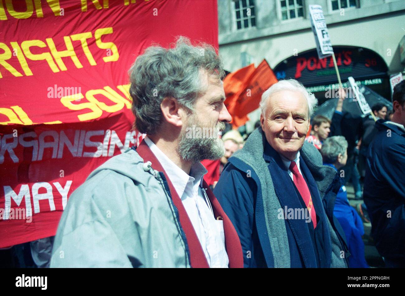 May day protest 1998, Tony Benn labour politician (on right) marches with Jeremy Corbyn (on left) also  Labour politican, in Central London Stock Photo