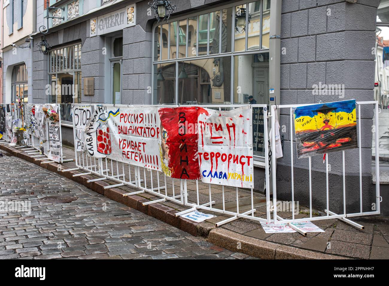 Banners protesting against Russian war crimes in Ukraine on a fence in front of the Embassy of the Russian Federation in Old Town of Tallinn, Estonia Stock Photo