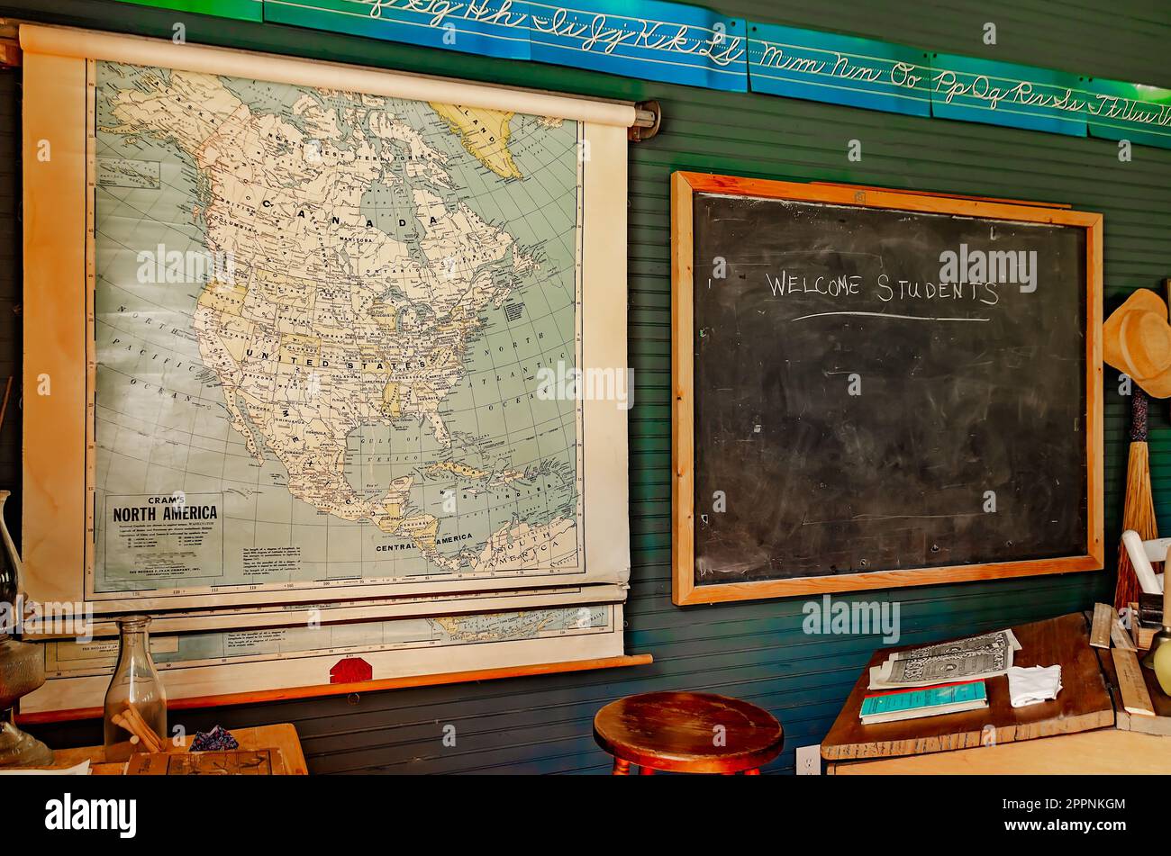A chalkboard welcomes students to the Little Red Schoolhouse in Baldwin County Bicentennial Park in Stockton, Alabama. Stock Photo