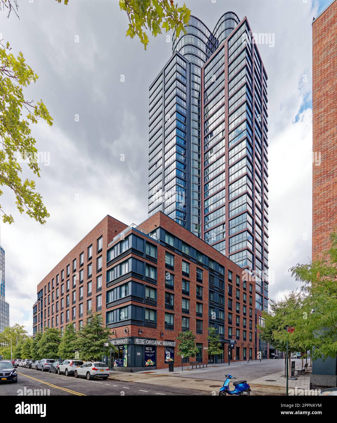 Two Blue Slip is a brick and glass tower capped by curved-façade  penthouses, The skyscraper is part of the Greenpoint Landing development  Stock Photo - Alamy