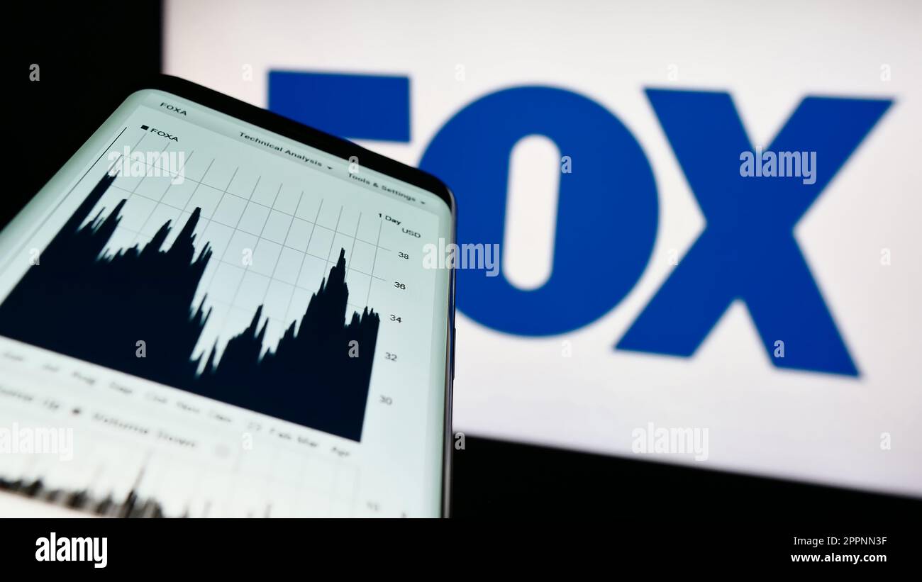 Smartphone with web page of US mass media company Fox Corporation on