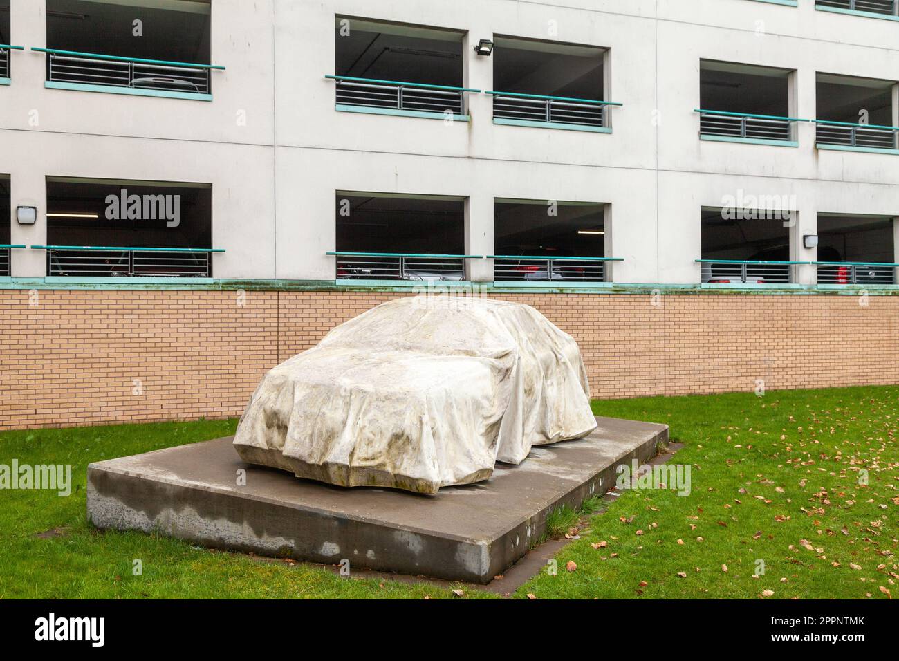 Catalyst Car Sculpture a draped lifesized car that has been cast in