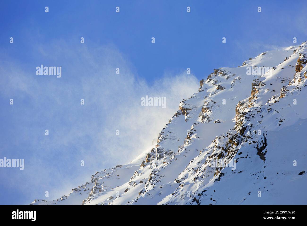 Snowstorm in the mountains in winter in the Gran Paradiso National Park, Aosta, Graian Alps, Italy Stock Photo