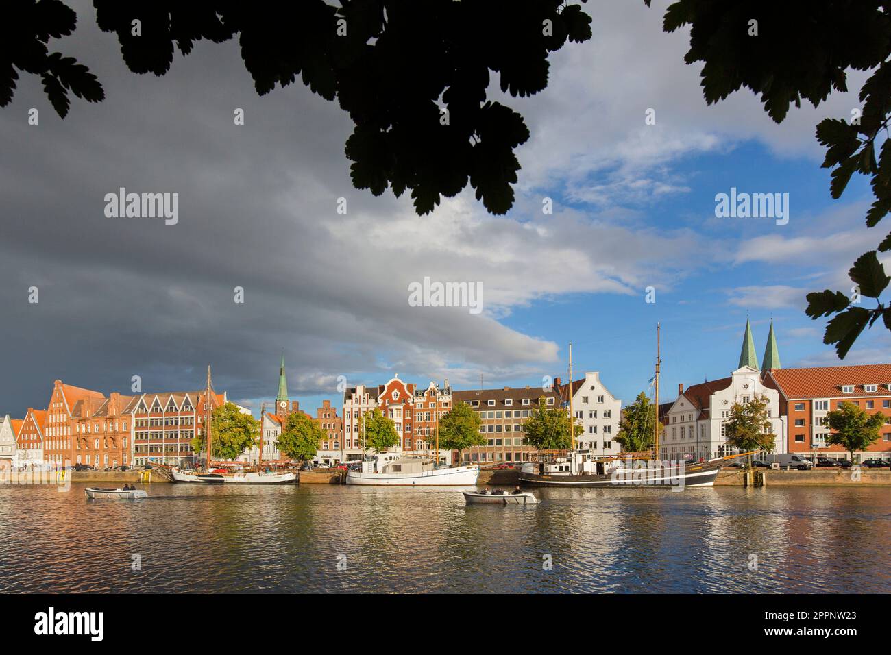 Museum harbour / Museumshafen Lübeck and traditional sailing ships berthed at the Untertrave in the Hanseatic town Lübeck, Schleswig-Holstein, Germany Stock Photo