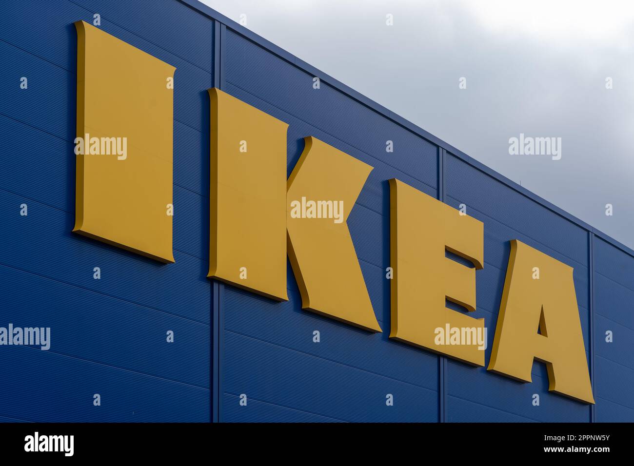 Closeup sideview of the iconic IKEA logo outside on the store