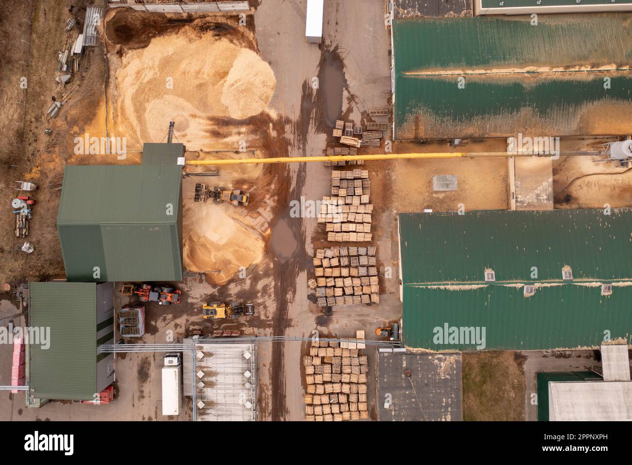 Drone footage of sawmill, machinery and lumber during summer day