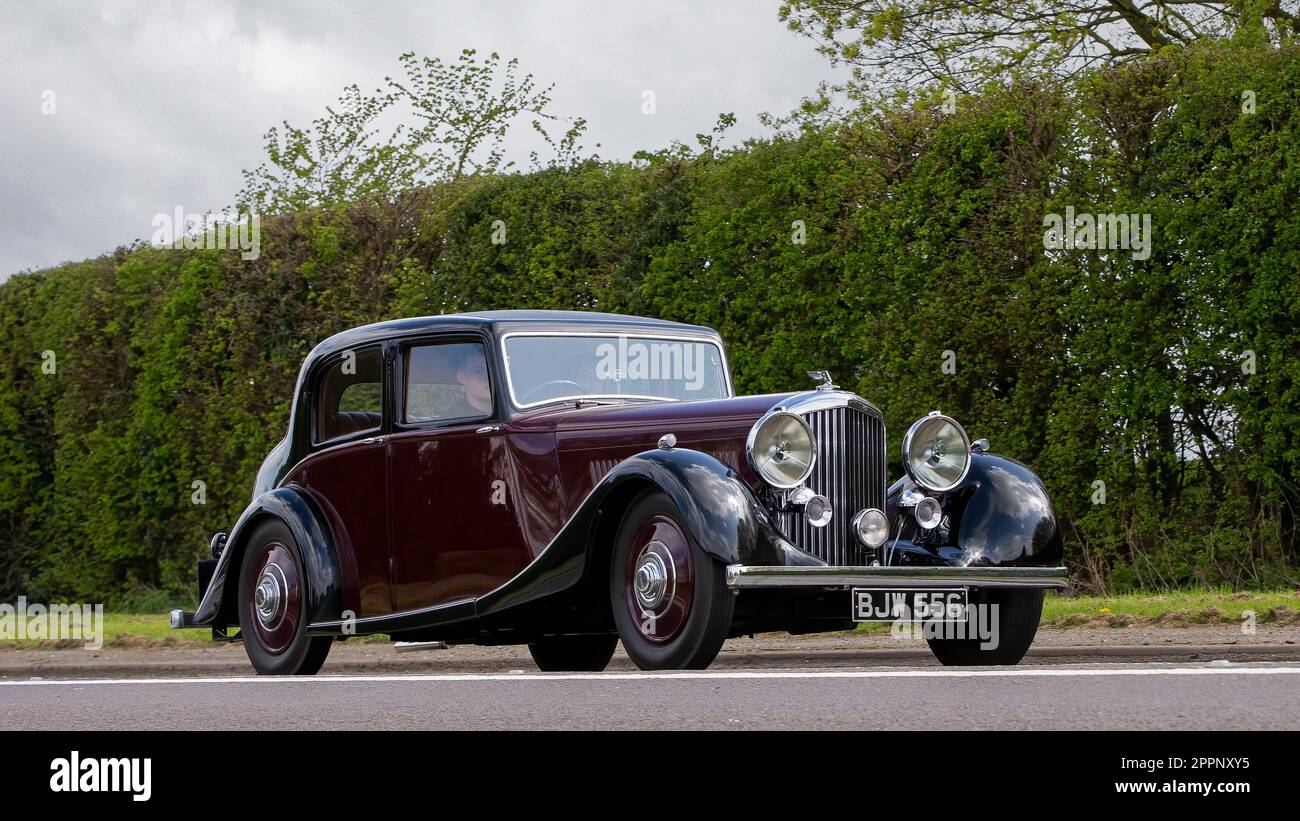 Bicester,Oxon,UK - April 23rd 2023.  1936 maroon Bentley 4¼ litre Saloon by Park Ward, one of only 12 built with this style of bodywork, travelling on Stock Photo