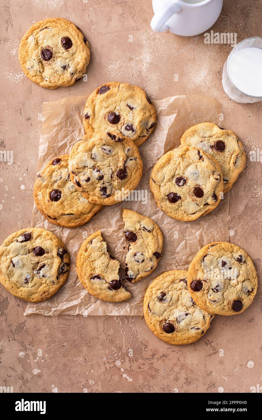 Chocolate chip cookies with flaky salt on parchment paper, homemade freshly baked cookies Stock Photo